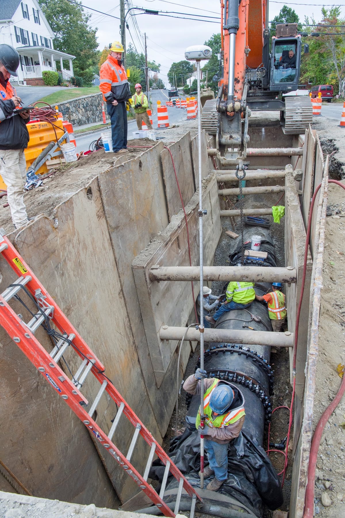 Lowering 48-inch ductile iron pipe into the Main Street trench.